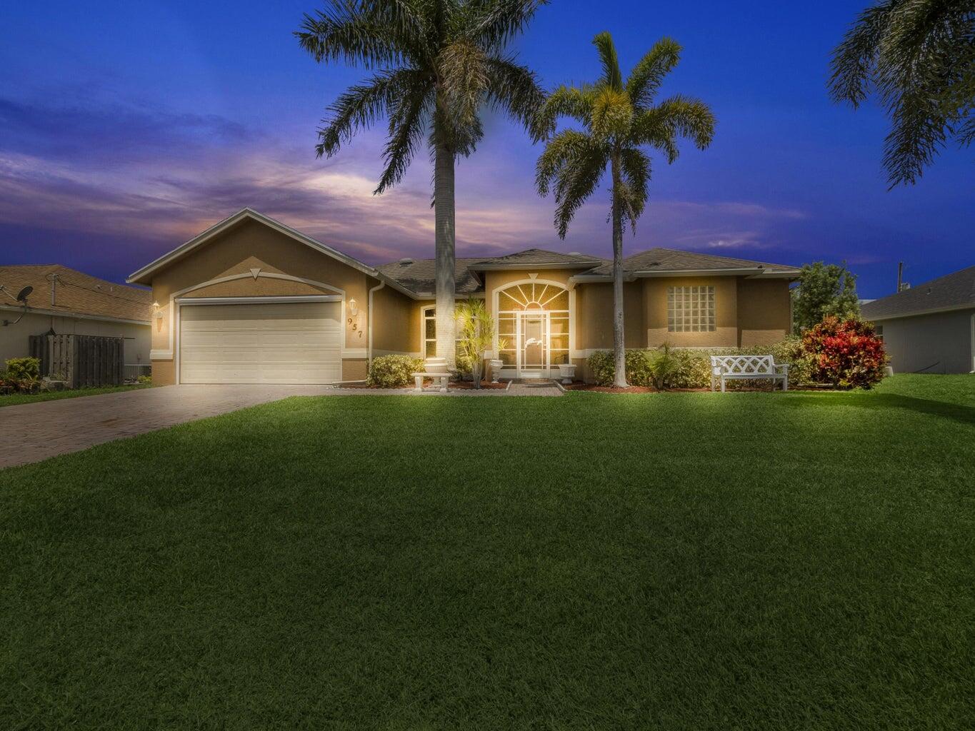 a front view of a house with a garden