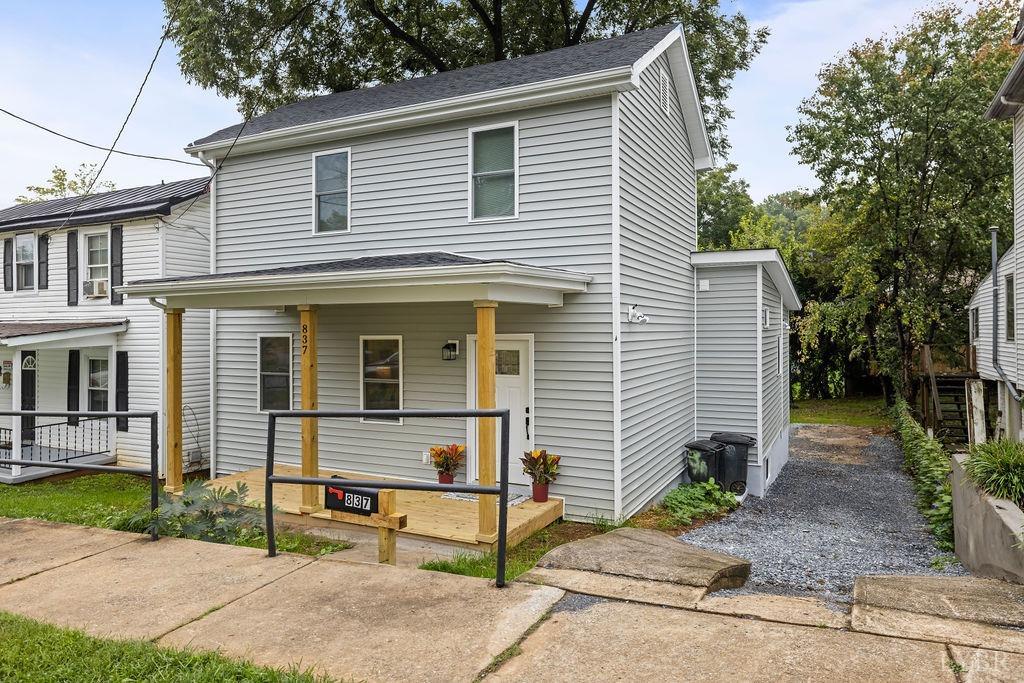 a view of a house with a yard and plants