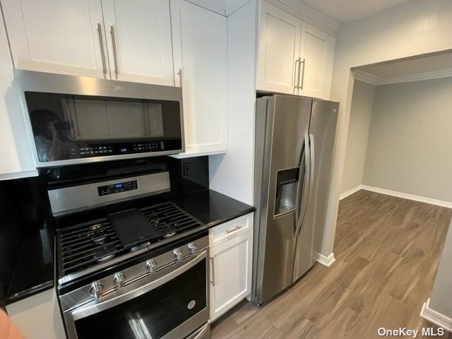 a kitchen with a stove and a refrigerator