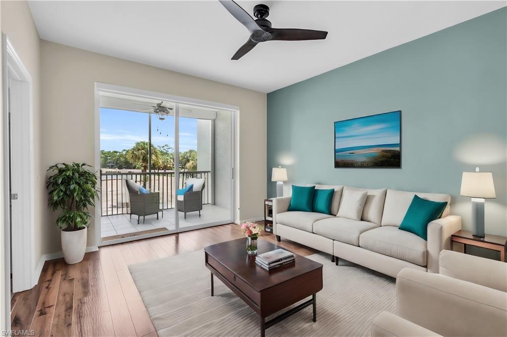 Living room featuring hardwood / wood-style floors and ceiling fan