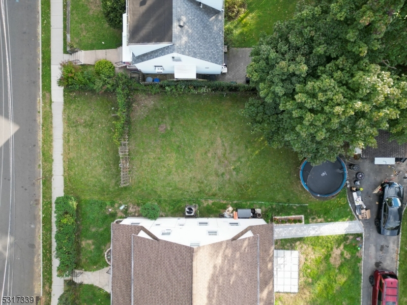 an aerial view of a house with outdoor space swimming pool