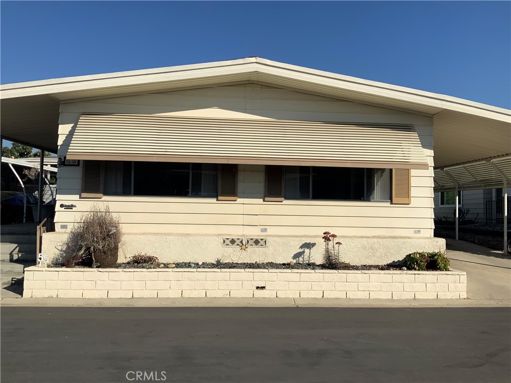 a view of a house with a street