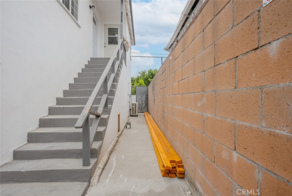 a view of staircase with white walls