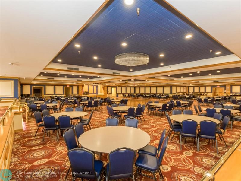 a very nice looking dining room with many tables and chairs