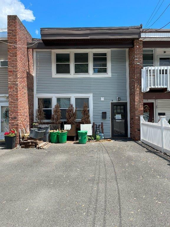 a view of a house with patio and a fire pit