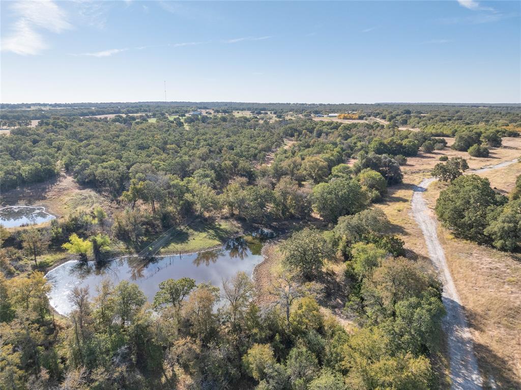 an aerial view of residential house and lake