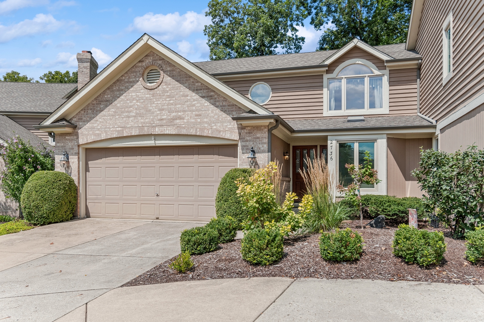 front view of a house with a yard