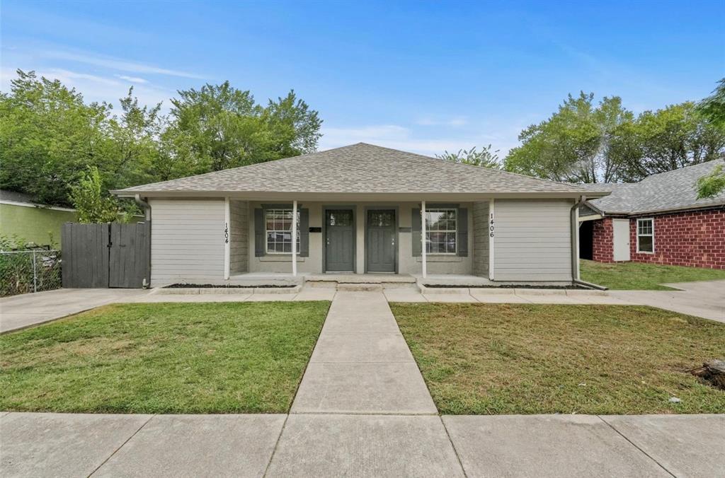 front view of a house with a yard