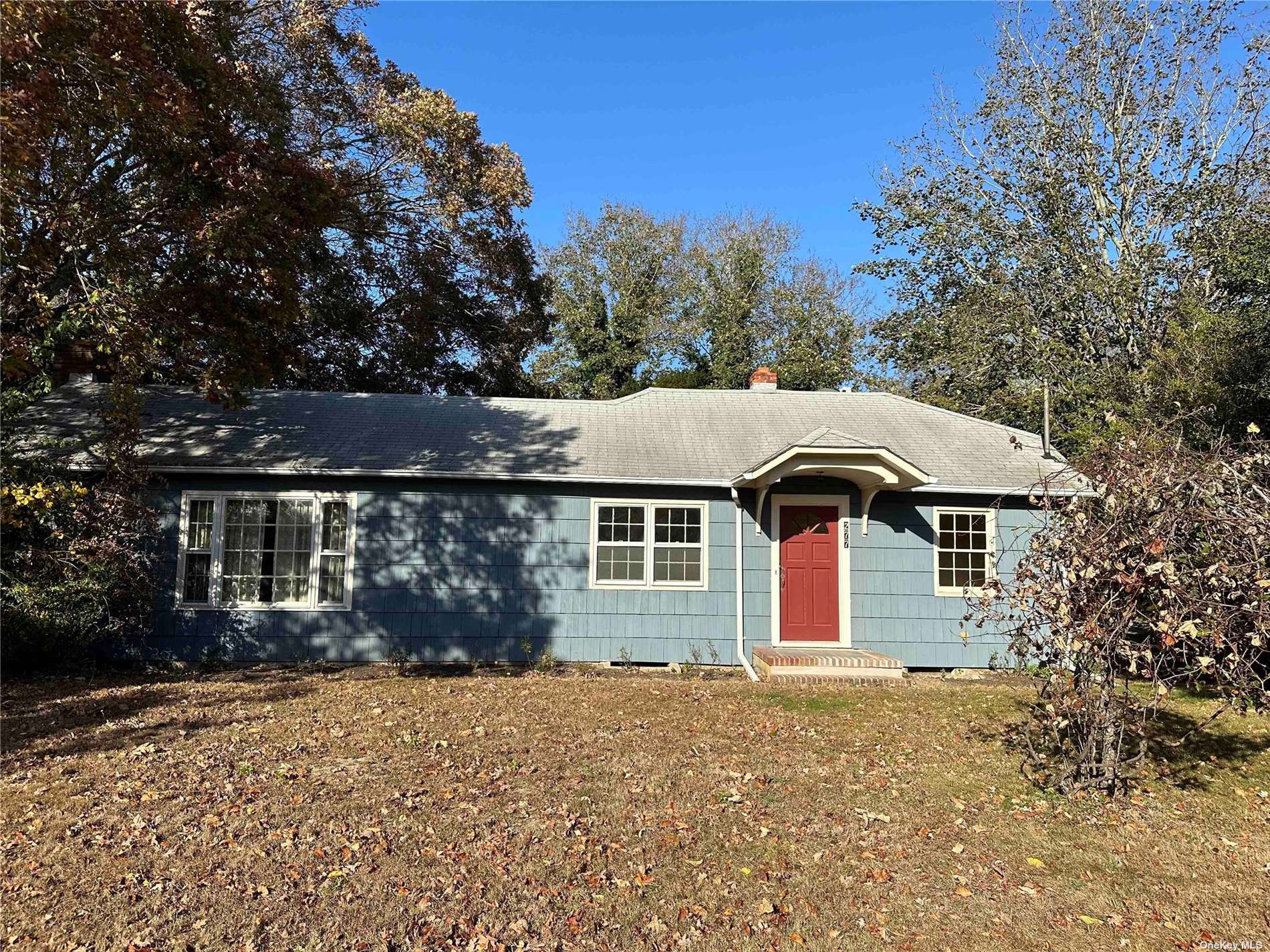 front view of a house with a yard