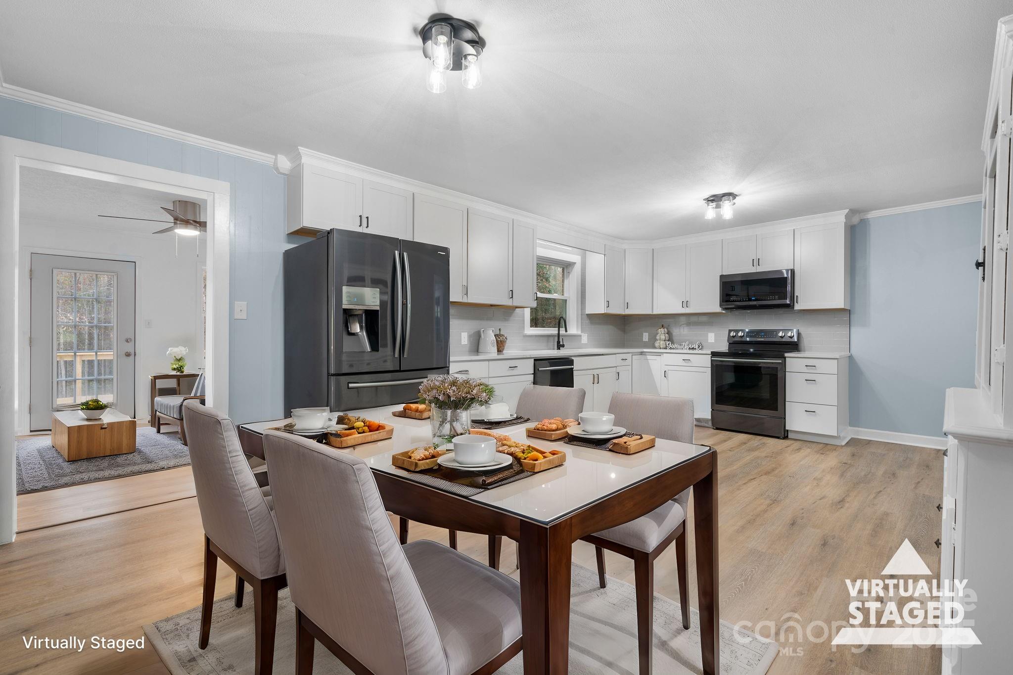 a kitchen with a table and chairs in it