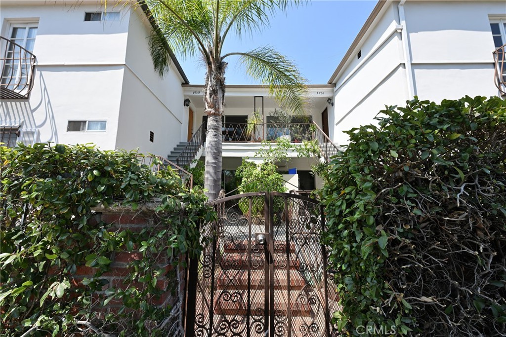 a view of a house with a tree