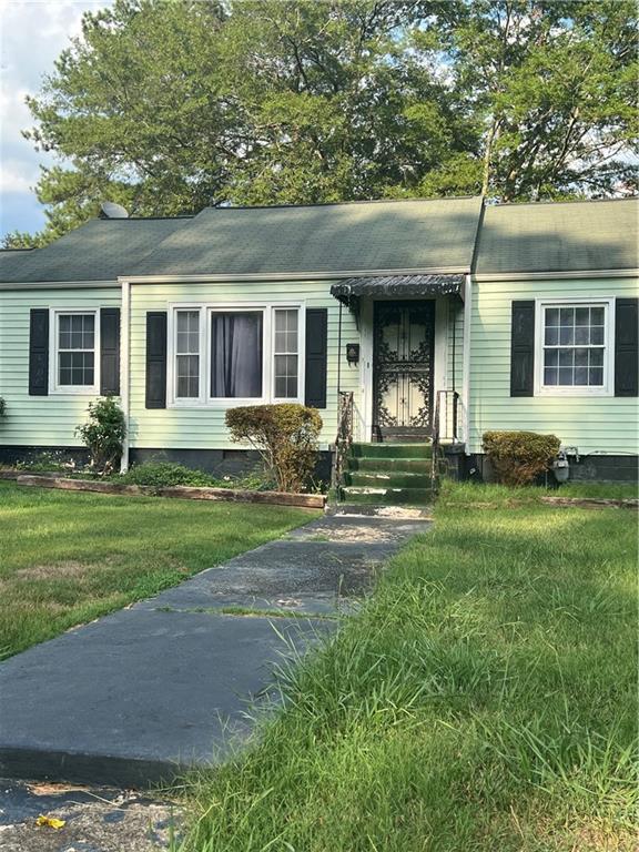 a front view of a house with yard