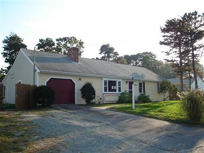 a view of house with yard and entertaining space