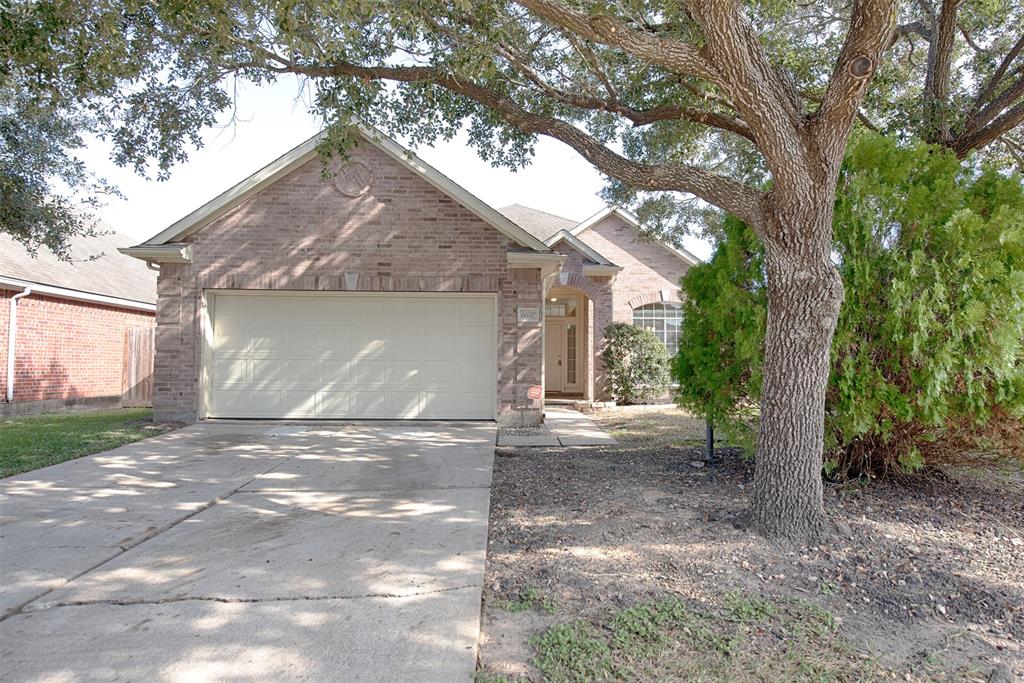 a view of a house with a tree