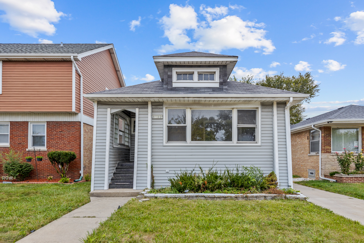 front view of a house with a yard