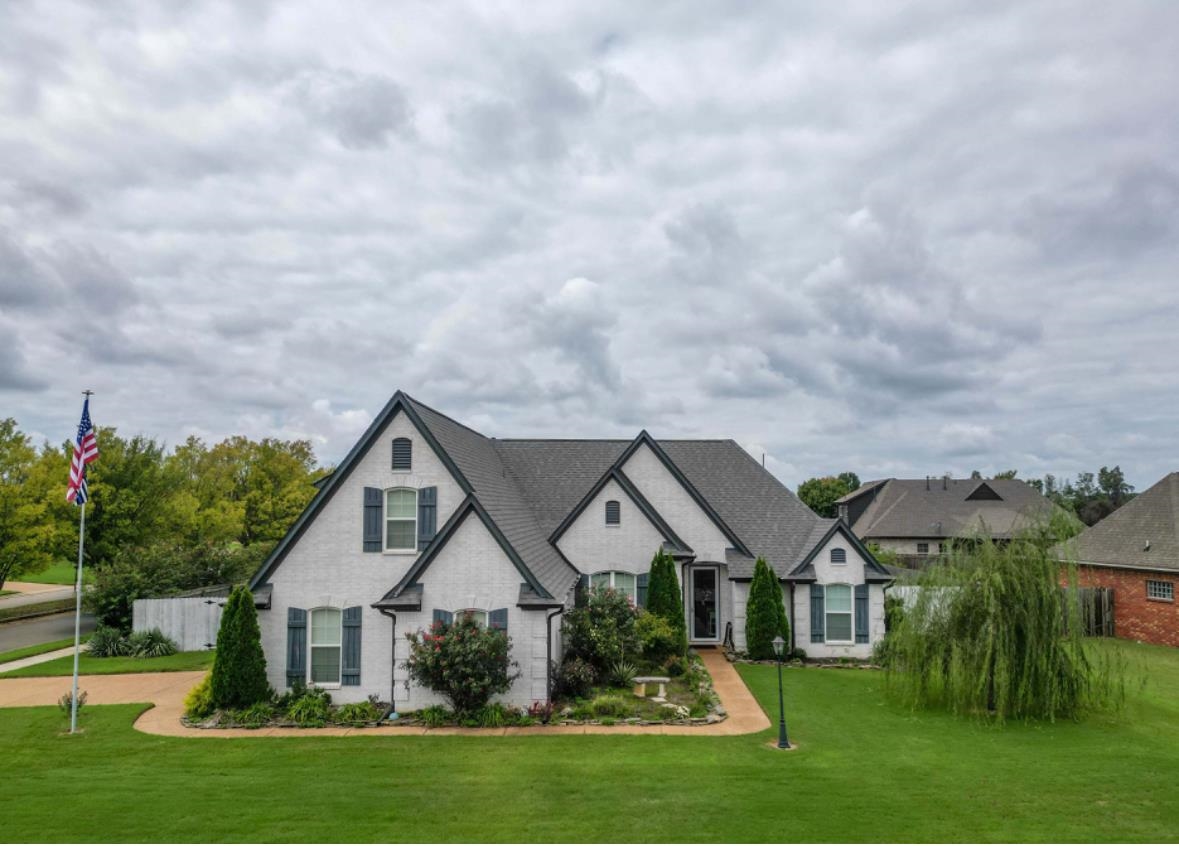 Stunning white brick home with massive yard