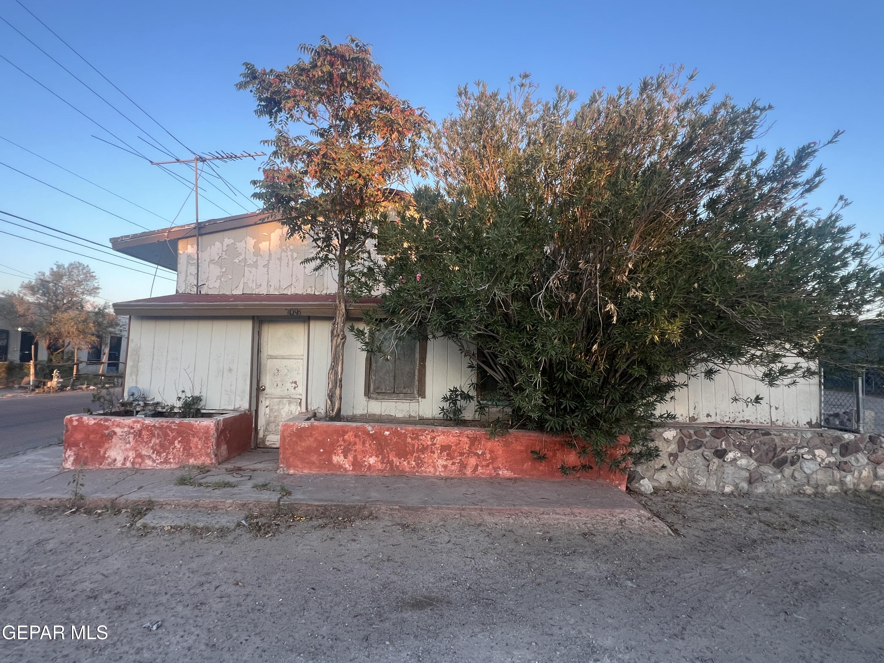 a front view of a house with yard