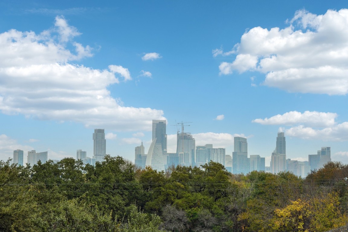 a view of a city with a building in the background