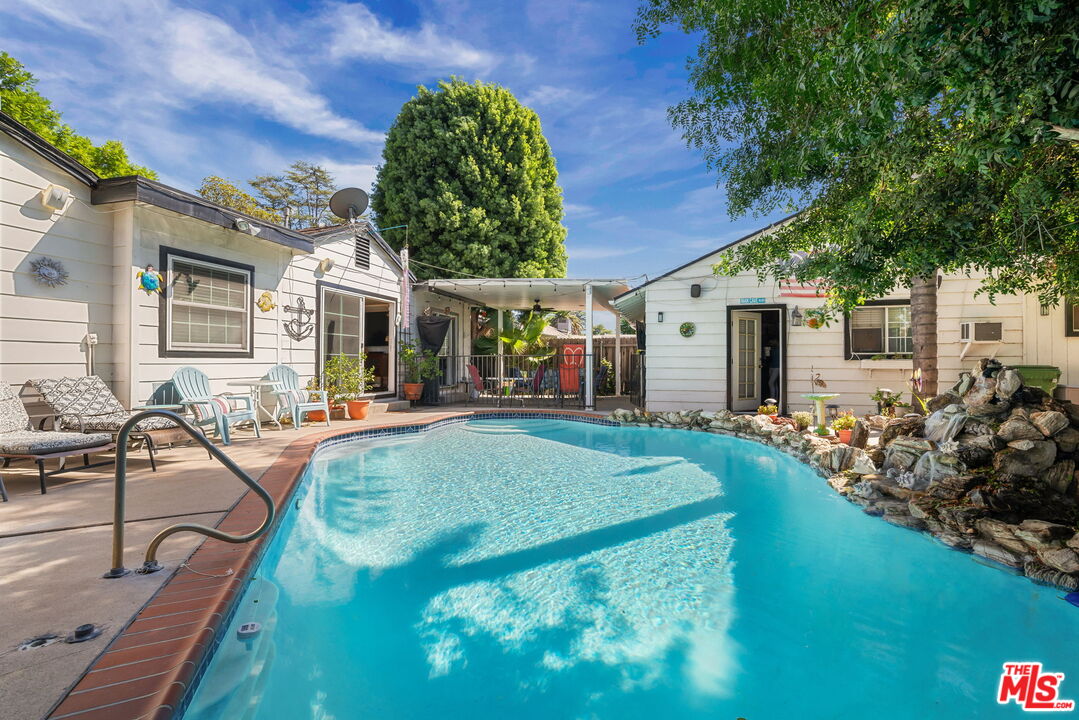 a view of a house with backyard porch and patio