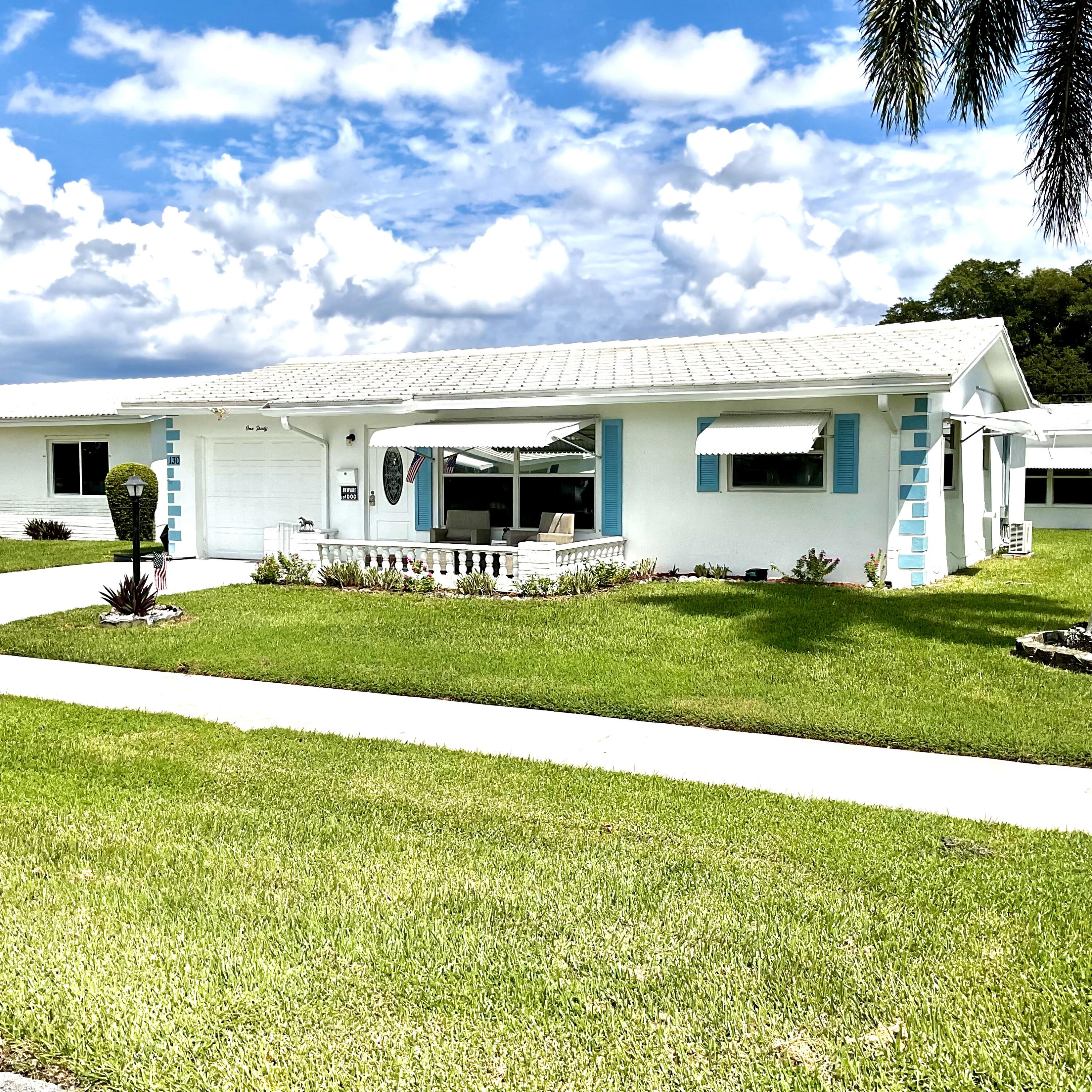 a view of an house with a big yard