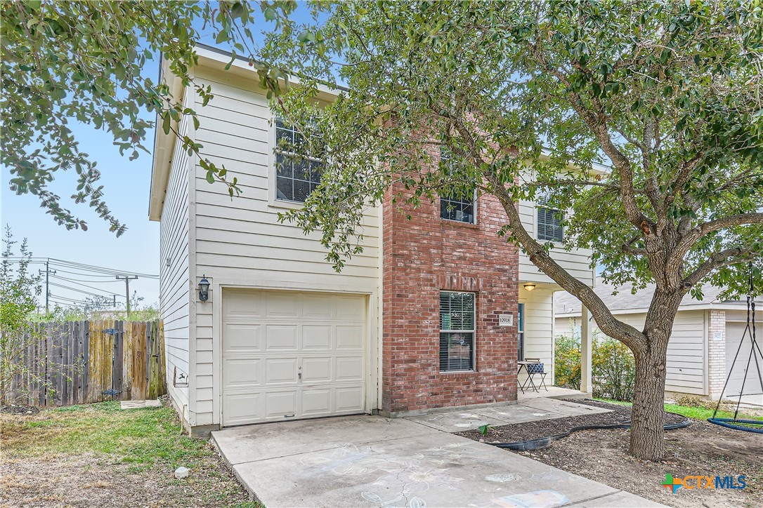 a view of a house with a garage