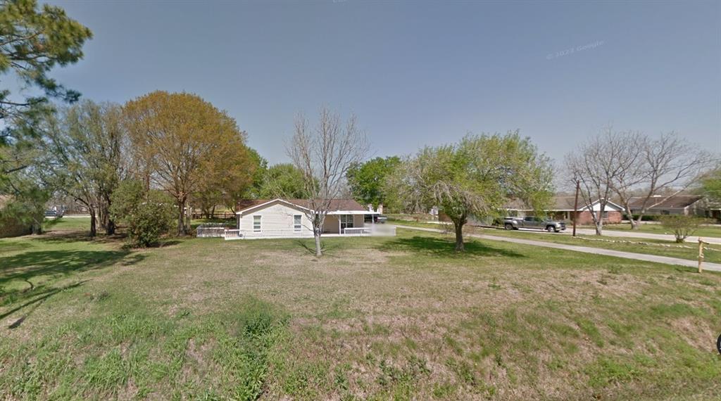 a house with trees in the background