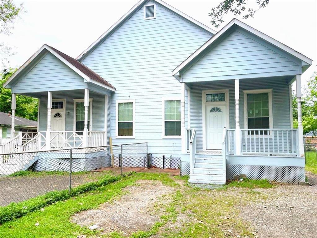 a view of house with backyard outdoor seating and barbeque oven