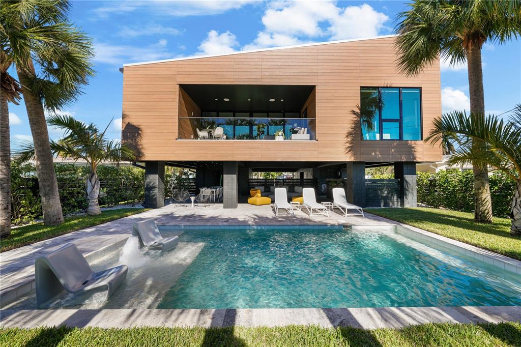 a view of house with yard outdoor seating and entertaining space