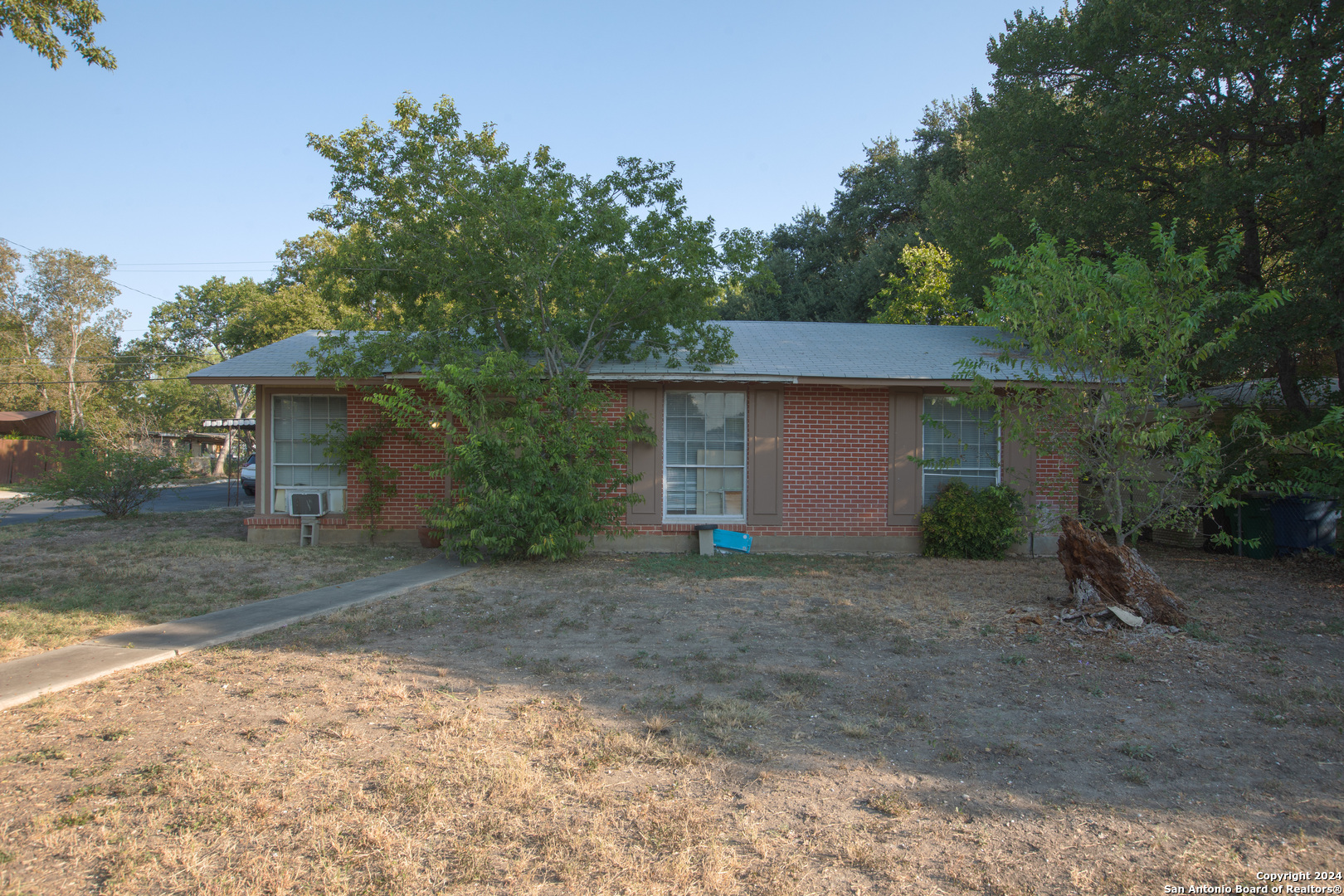 front view of a house with a yard