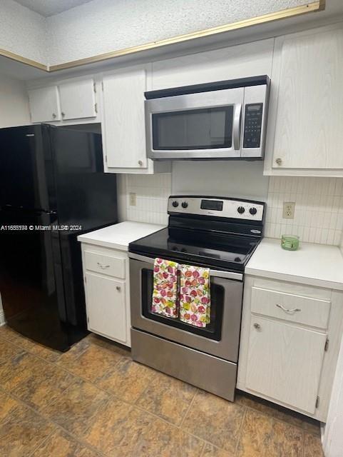 a kitchen with a stove and a microwave