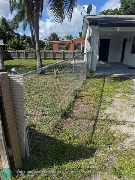 a view of swimming pool with a yard