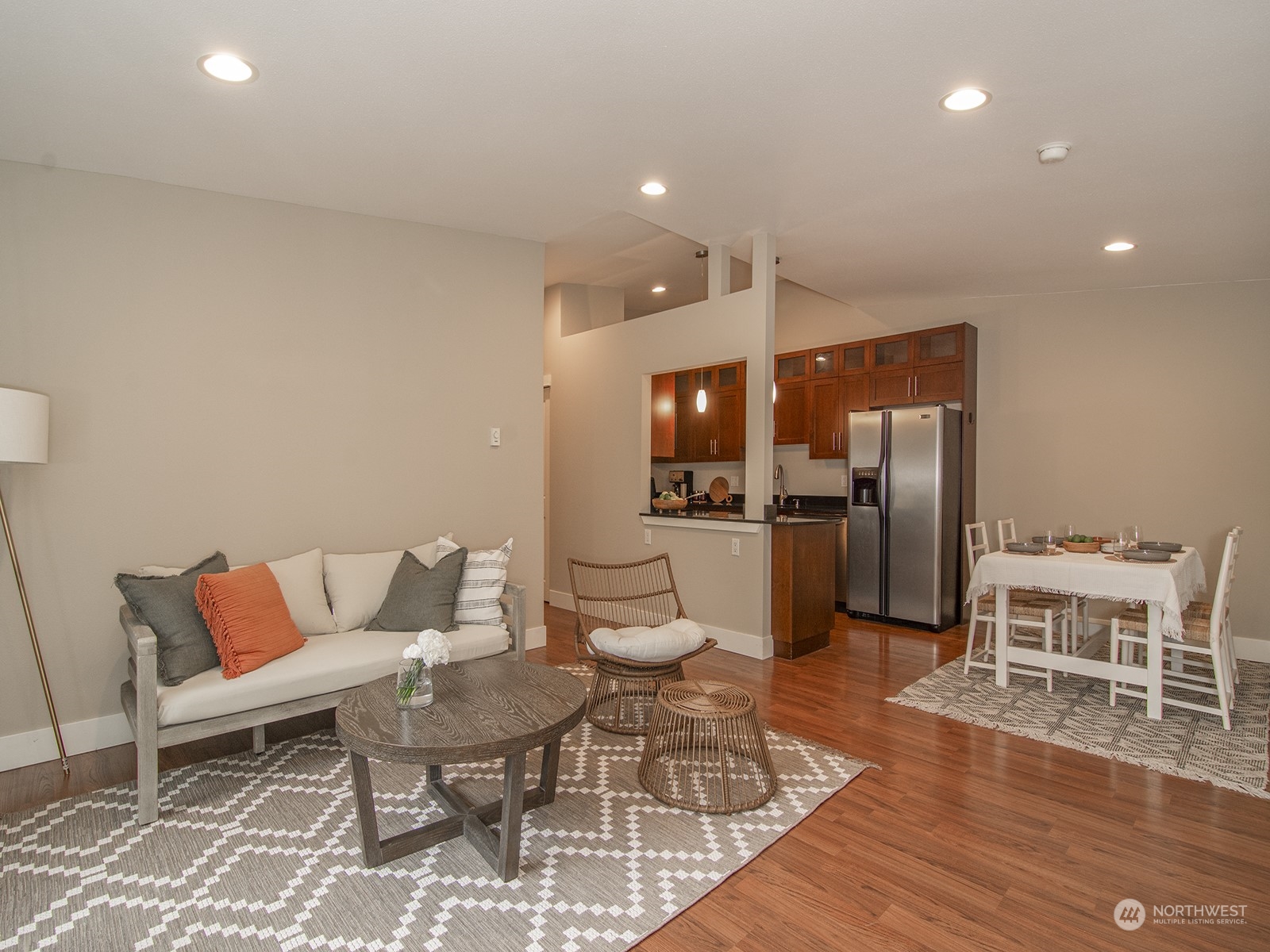 a living room with a couch and wooden floor