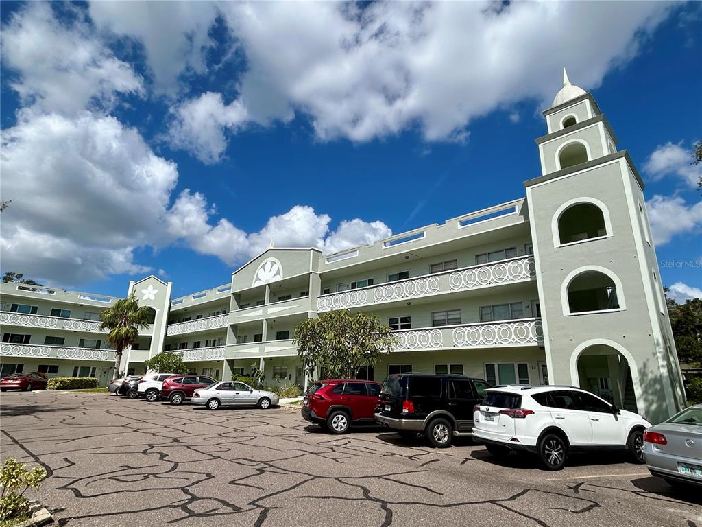 a building with cars parked in front of it