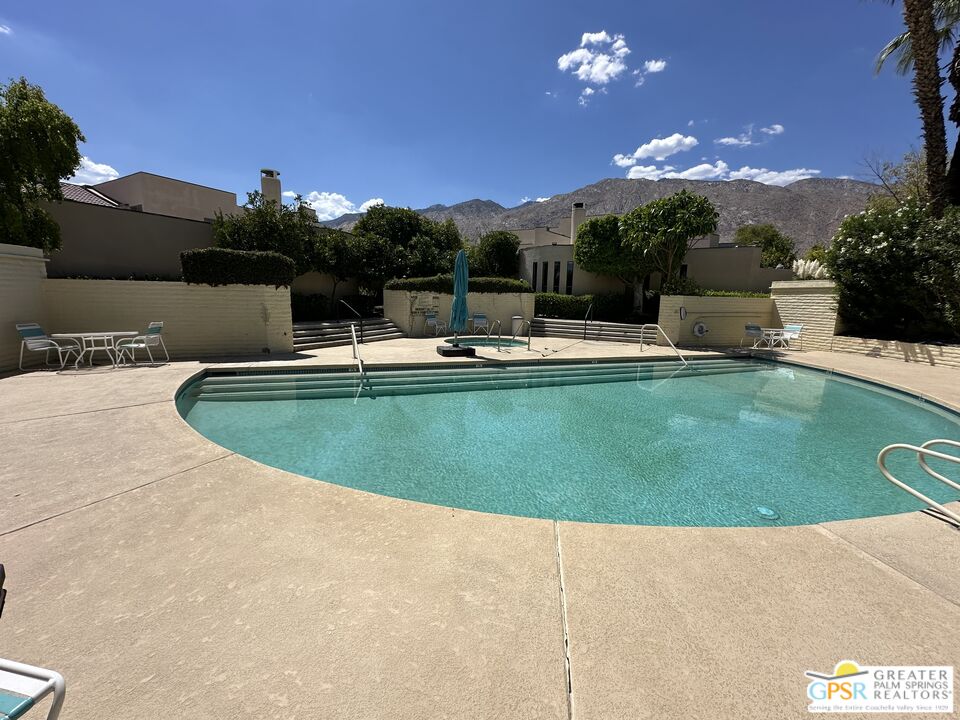 a view of a swimming pool with a patio