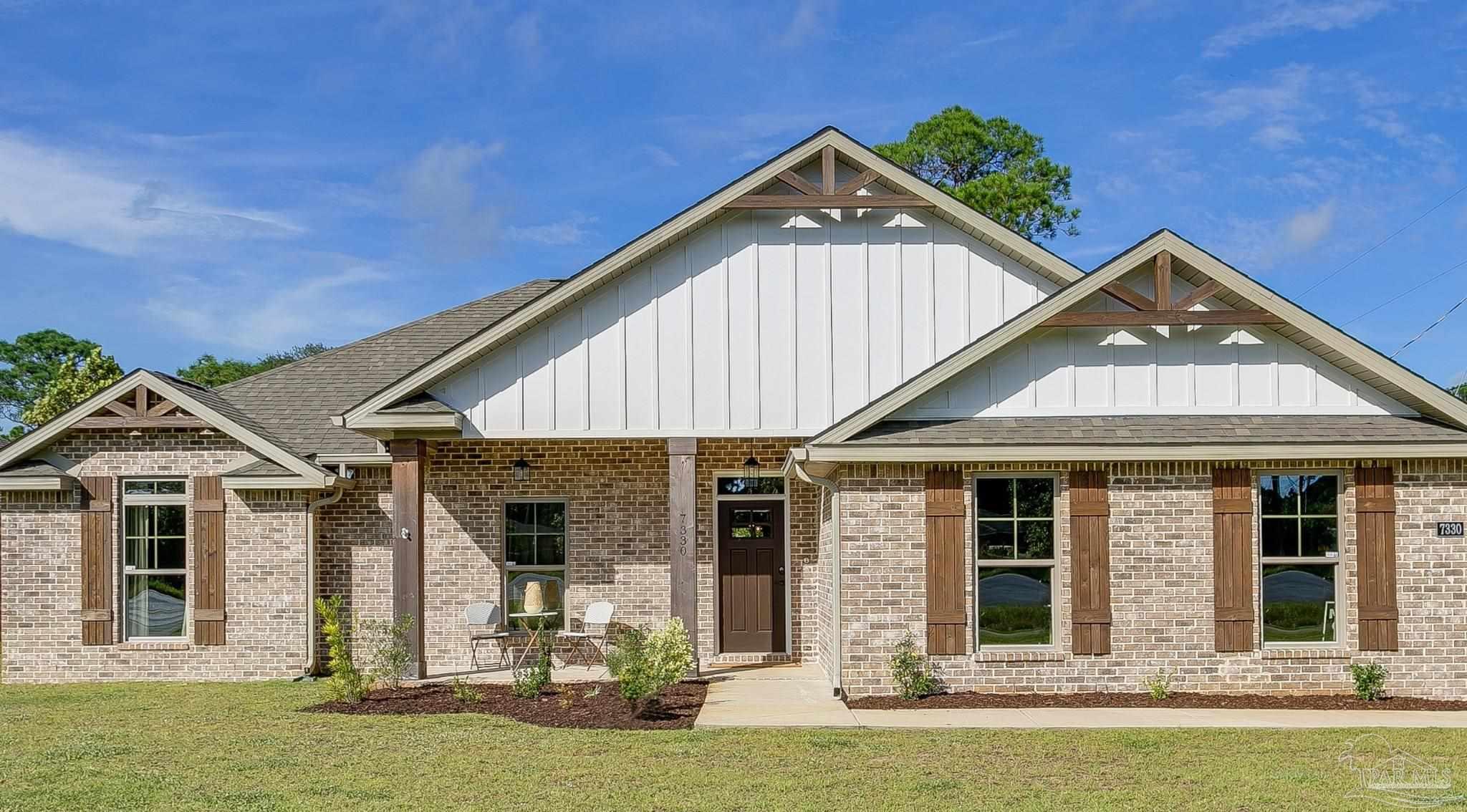 front view of a house with a yard