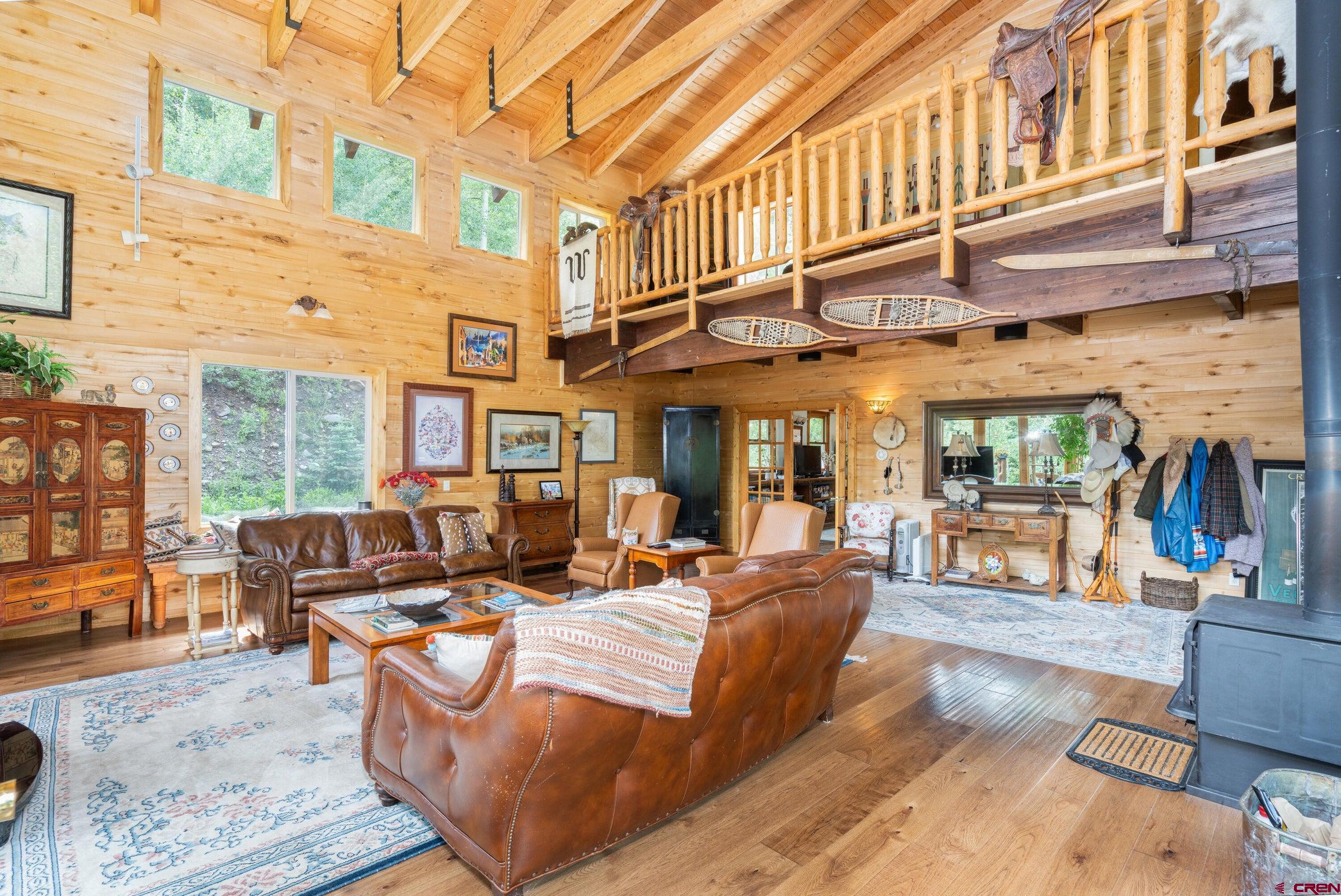 a outdoor living area with furniture and a ceiling fan