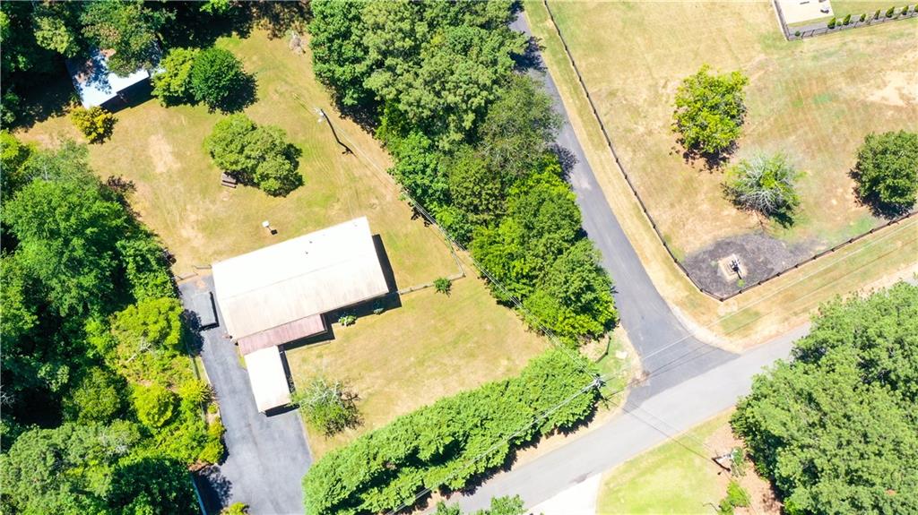 an aerial view of a house with swimming pool