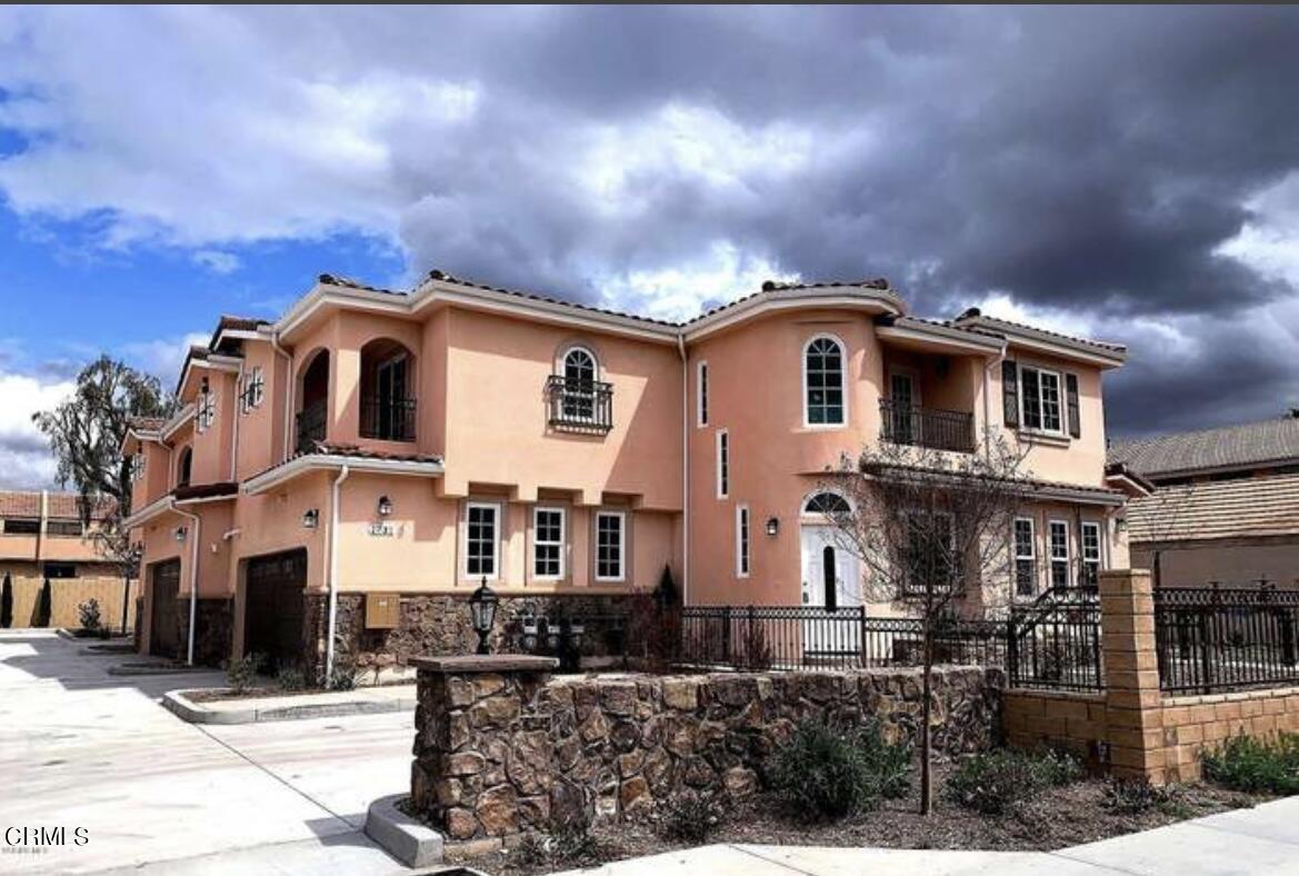 a front view of a house with yard