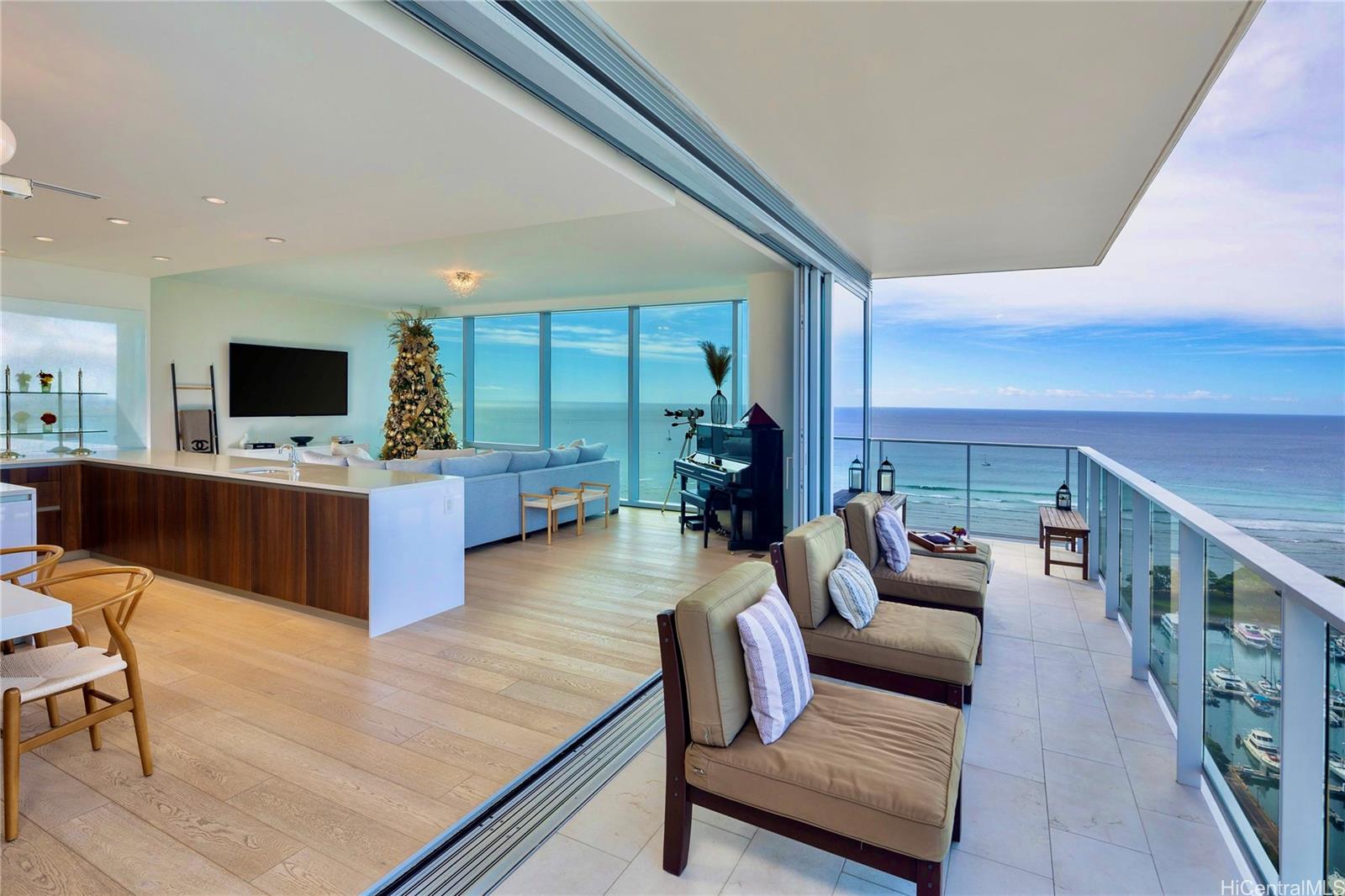 a living room with furniture flat screen tv and a large window