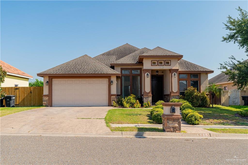 front view of a house with a small yard