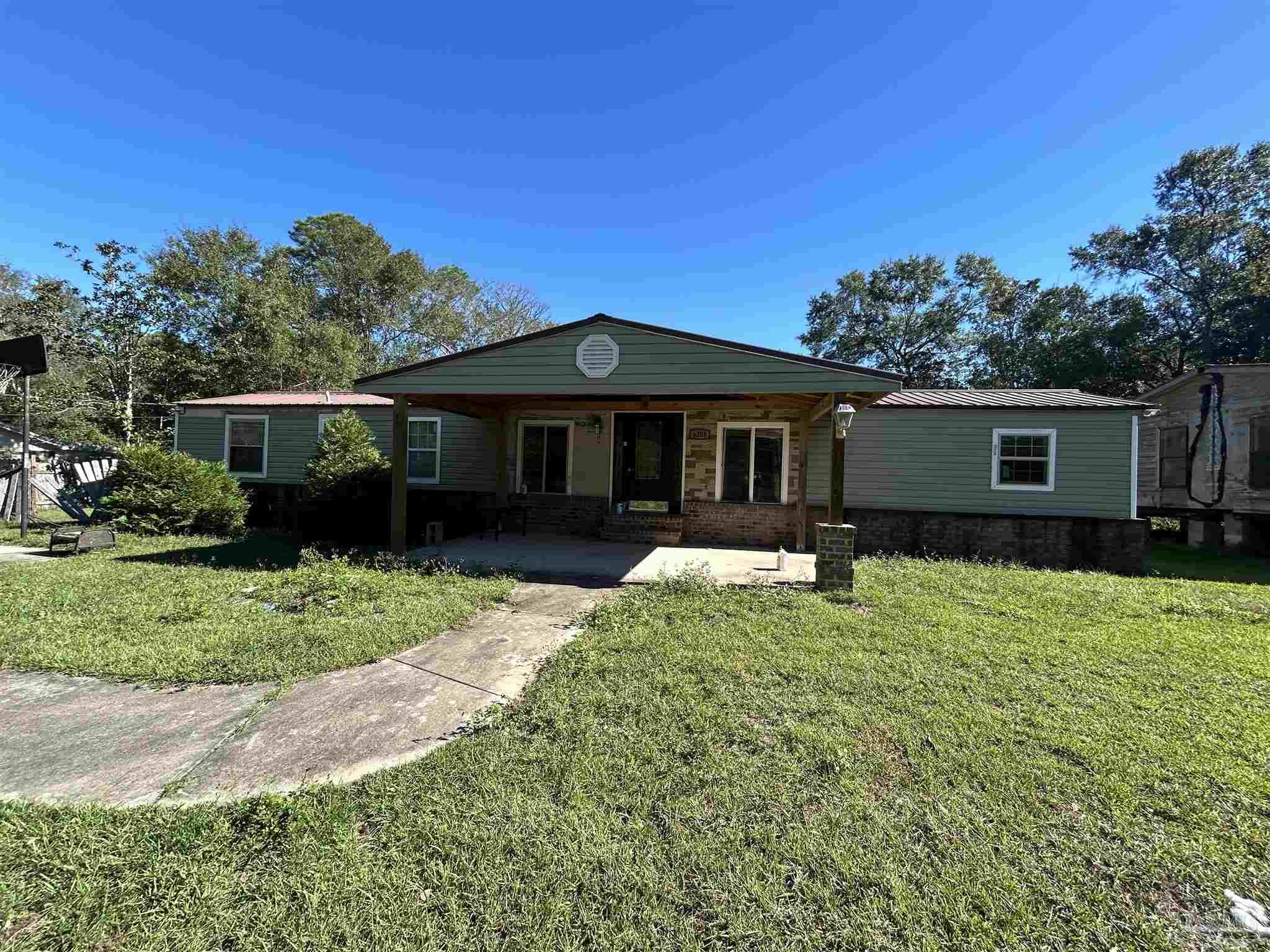 front view of a house with a yard