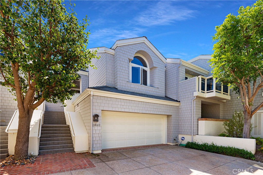 a front view of a house with a garage