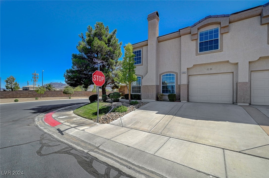 One car garage with parking space in driveway for