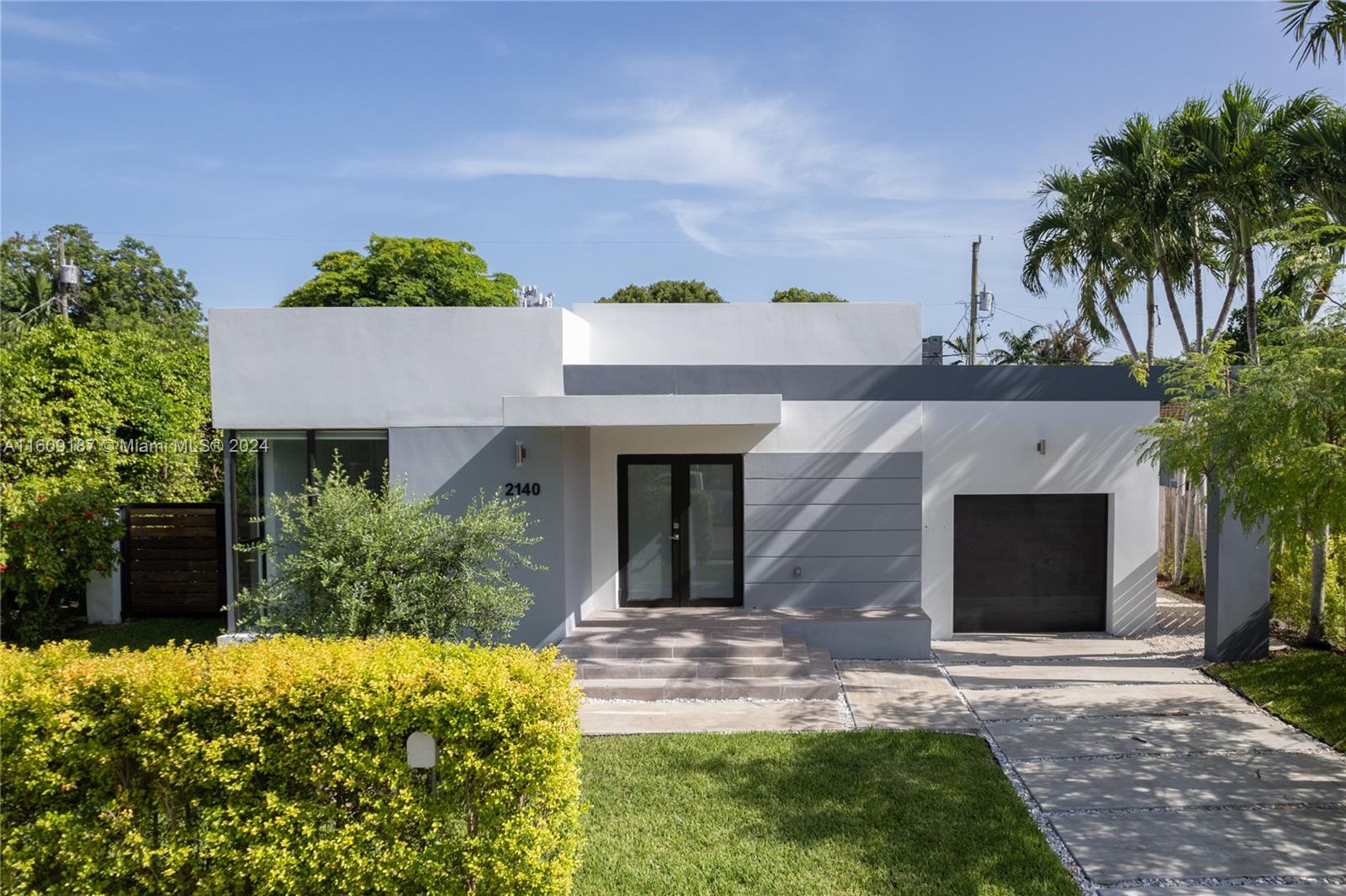 front view of a house with a yard