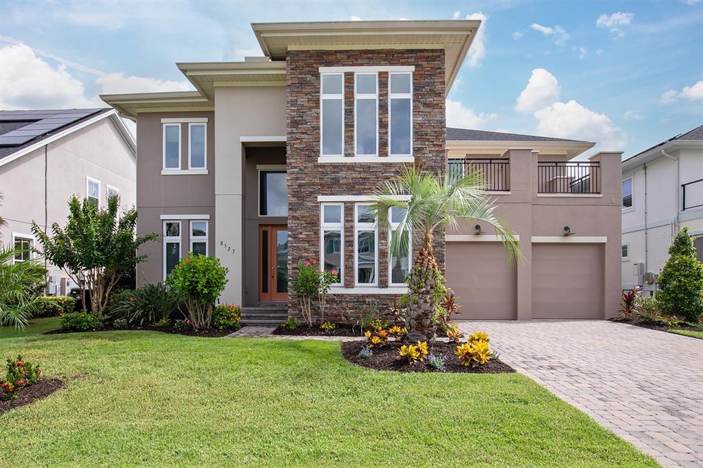 a front view of a house with garden