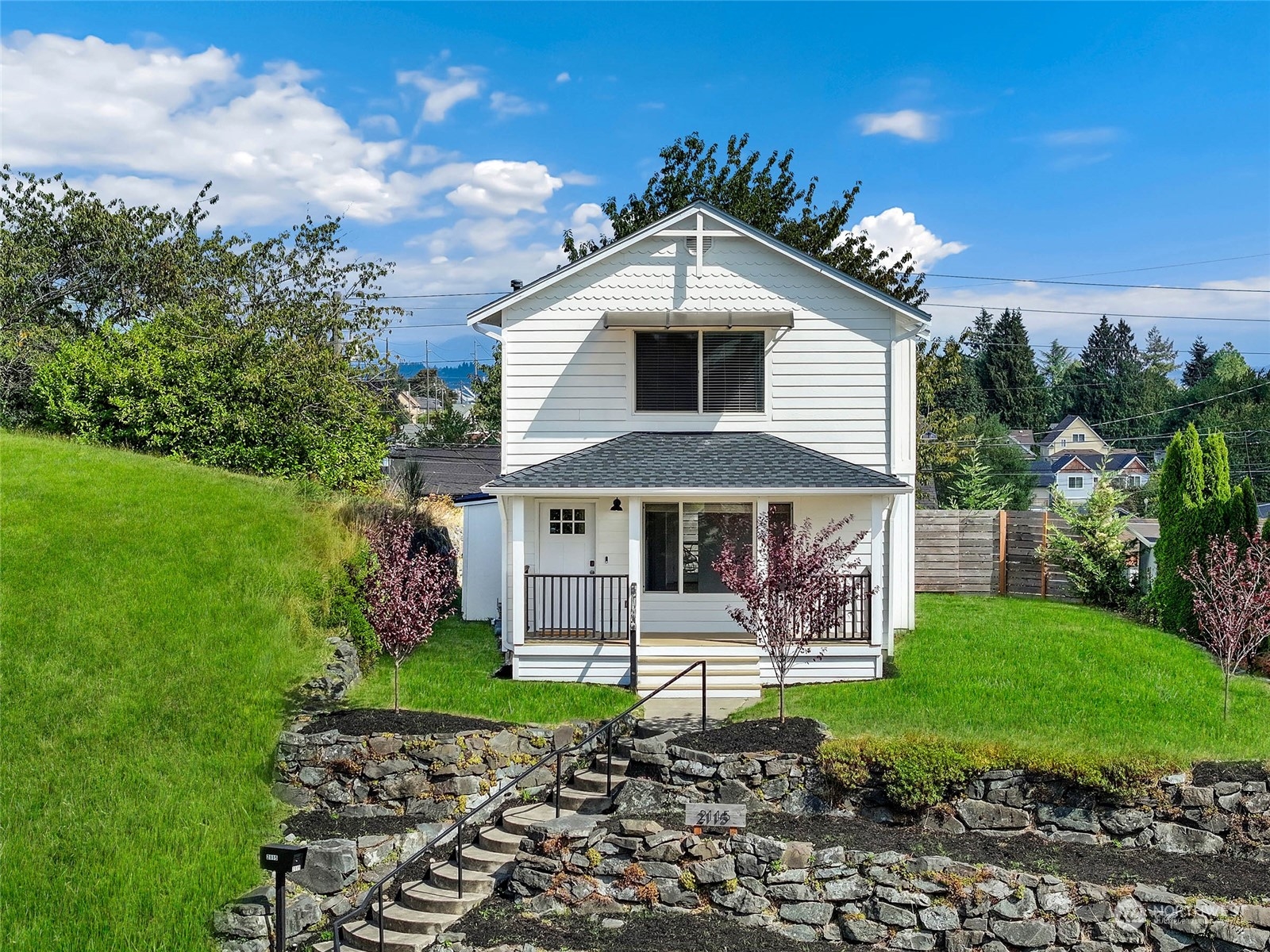 a front view of a house with garden