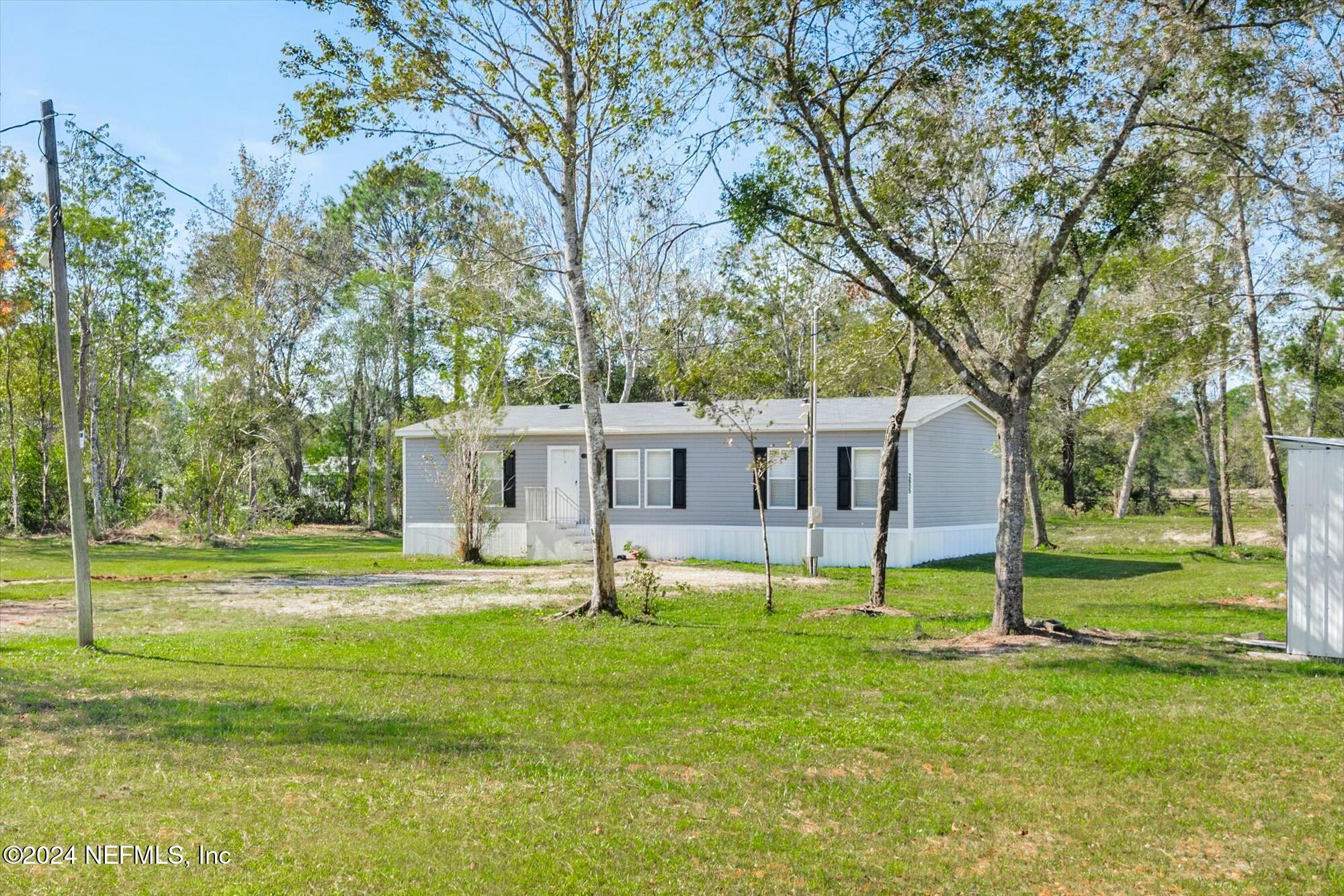 a house view with a sitting space and garden