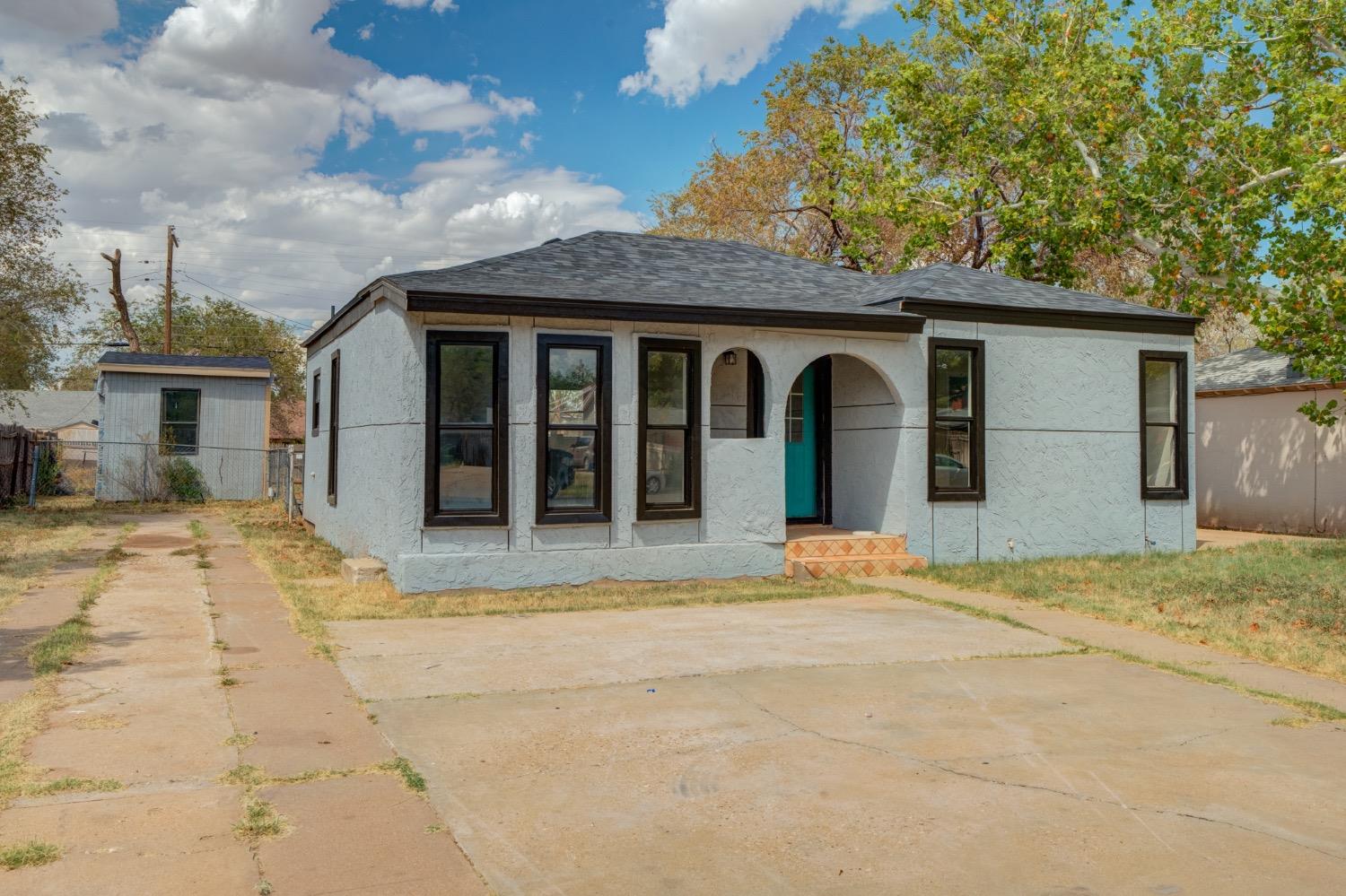 front view of a house with a yard