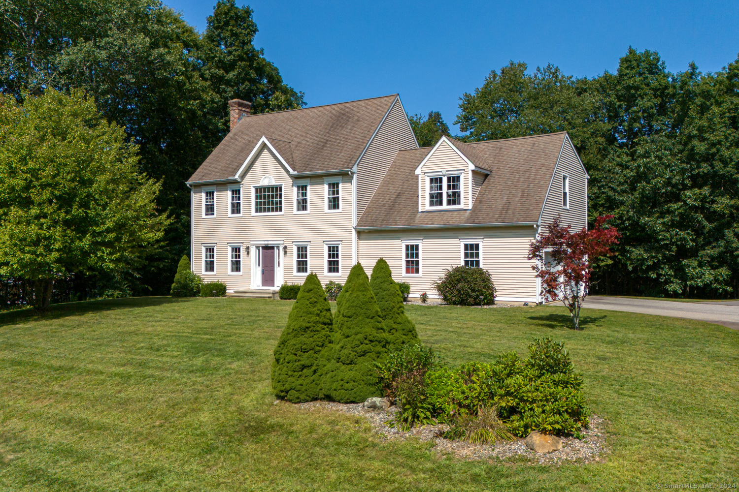 a view of a house with a garden