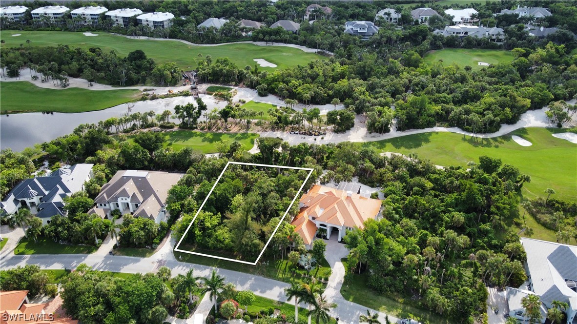 an aerial view of house with yard swimming pool and outdoor seating